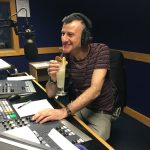 Gavin sipping a cocktail